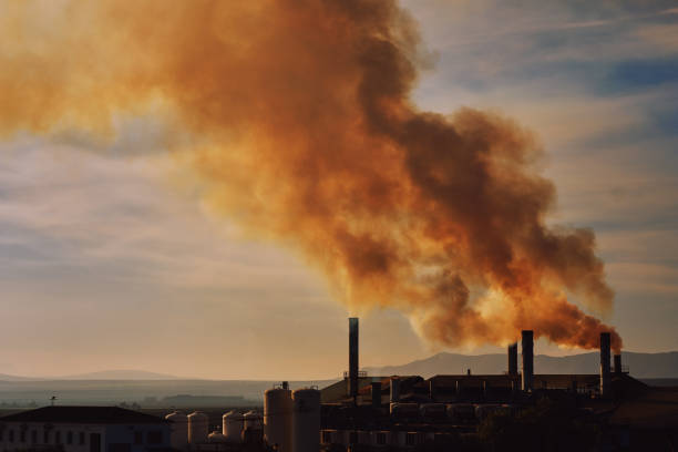 Power plant, smoke from the chimney. Spain Power plant, smoke from the chimney. Air pollution environmental contamination, ecological disaster earth planet problems concept. Photo taken in Spain, Granada, Espana ozone layer photos stock pictures, royalty-free photos & images