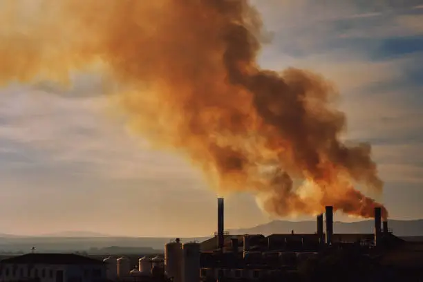 Photo of Power plant, smoke from the chimney. Spain