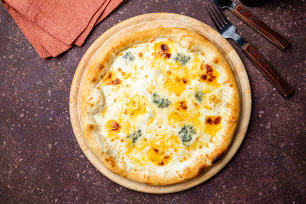 istock Pizza Quattro formaggi on concrete table top view 1221206666