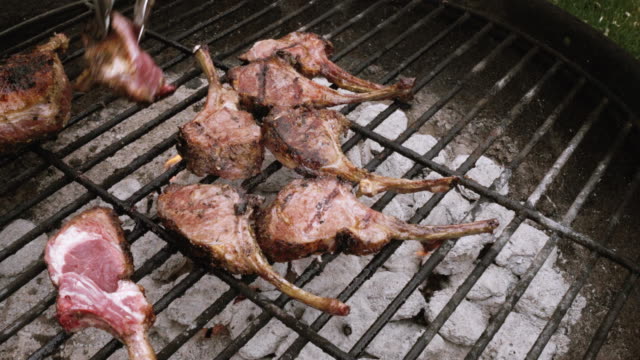Delicious Gourmet Grilled French Lamb Chops On A Charcoal Grill With Flames