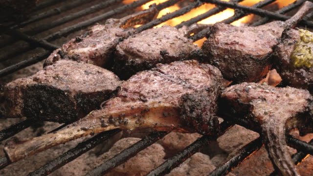 Delicious Gourmet Grilled French Lamb Chops On A Charcoal Grill With Flames