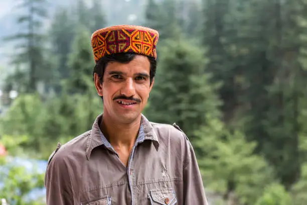 portrait of a man from Himachal Pradesh, India with traditional himachali cap