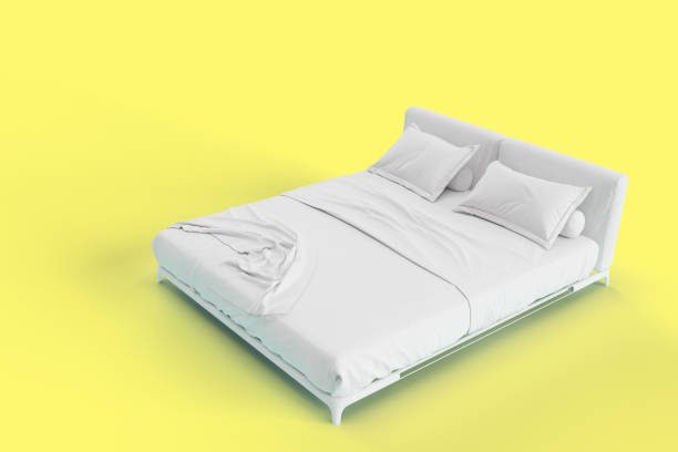 istock 3d render right side angle view of white bed with white pillow cover and white bed sheet and blanket for mockup with a solid yellow background. 1221209176
