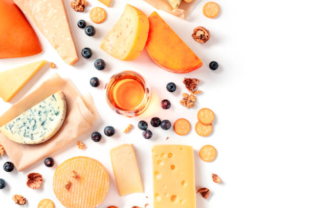 istock Cheese and wine tasting and pairing flat lay on a white background with a place for text. Many different cheeses, shot from above 1221209206