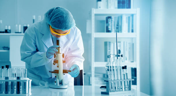 istock Asian scientist or doctors use microscopes to test for the coronavirus (COVID 19). Or a new flu virus to save human life In the lab Or hospital. Successful in researching the treatment of patients 1221210748