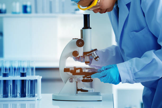 istock Asian scientist or doctors use microscopes to test for the coronavirus (COVID 19). Or a new flu virus to save human life In the lab Or hospital. Successful in researching the treatment of patients 1221210766