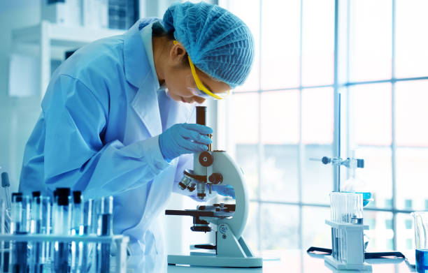 istock Asian scientist or doctors use microscopes to test for the coronavirus (COVID 19). Or a new flu virus to save human life In the lab Or hospital. Successful in researching the treatment of patients 1221210768