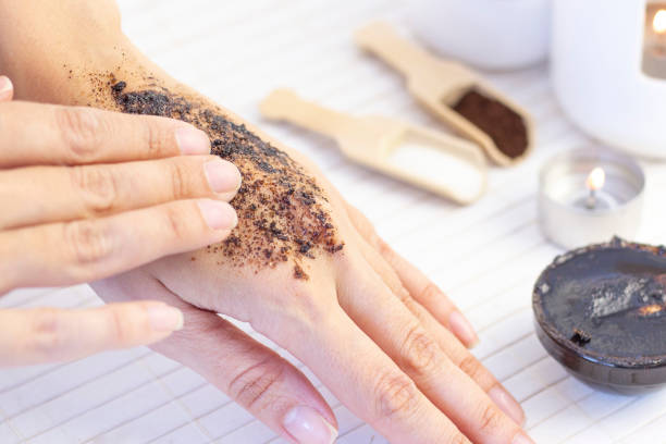istock Natural scrub made from coffee and sugar. hand peeling sugar scrub with coffee. spa hand treatment. 1221211859