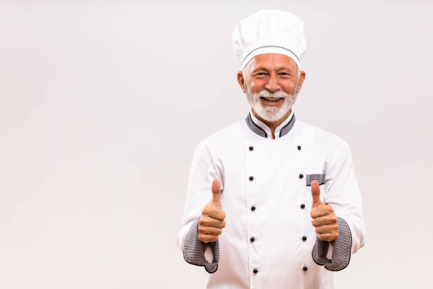istock Senior chef showing thumb up 1221211902