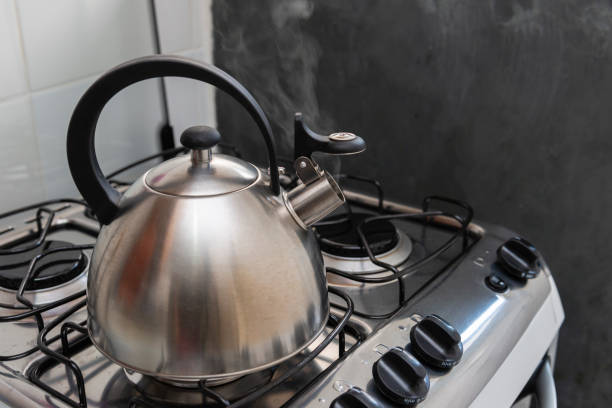 istock Kettle with hot water on the stove 1221212110
