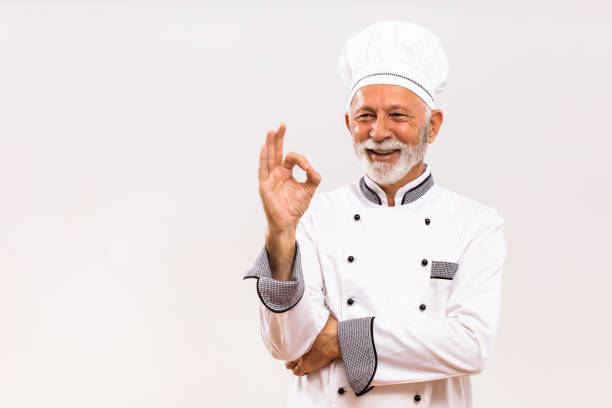 istock Senior chef showing ok sign 1221212215