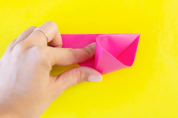 istock Step 7. DYI tulip from colored paper. Step-by-step instruction. DIY gift for Mother's Day, March 8th. 1221212282