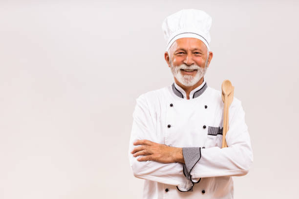 istock Portrait of  senior chef with work tool 1221214498