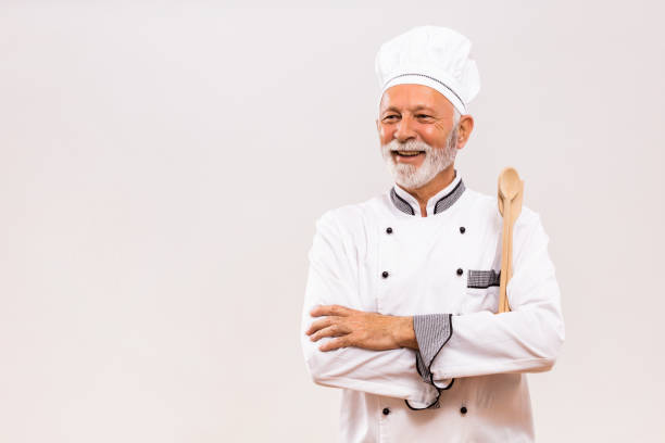istock Portrait of  senior chef with work tool 1221214627