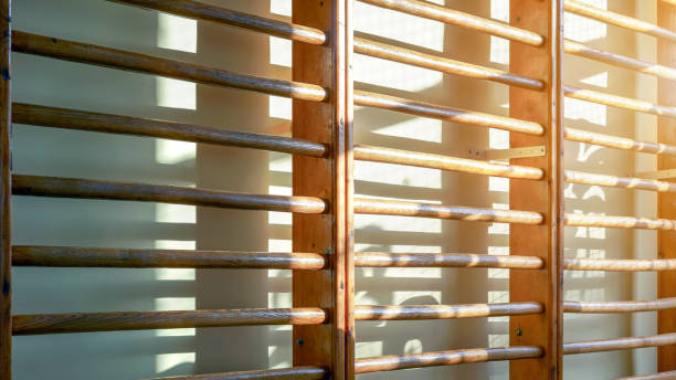 wooden bar in gym close-up view wooden bar equipment in gym close-up view wall with shadows background school sport high up tall stock pictures, royalty-free photos & images