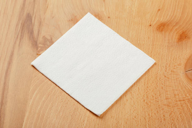 istock white paper napkin or tissue on the wooden table background. 1221215493