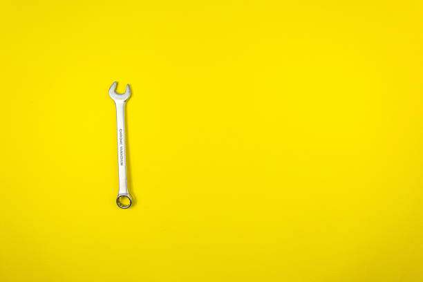 istock One wrench on a yellow background 1221218312