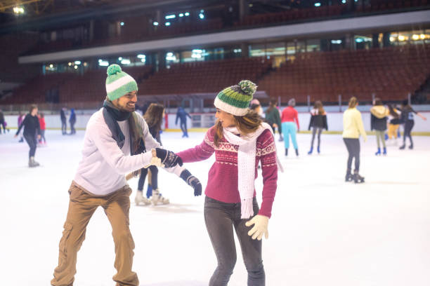 istock Young couple ice skating in winter 1221222118