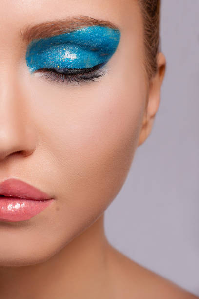 istock Young attractive girl with closed eyes. Bright makeup 1221222335