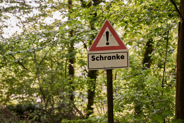 istock A red and white warning sign for a railroad crossing gate in the forest 1221223104