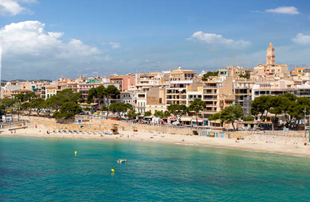 Porto Cristo, Mallorca, Spain - April 29, 2016: Emerald waters of Mediterranean Sea on Porto Cristo beach, Majorca island, Spain