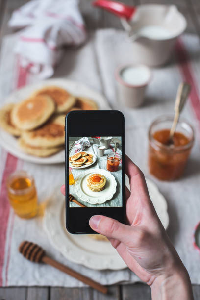 istock Homemade yeast pancakes stack on a white plate with apricot jam and honey 1221223874