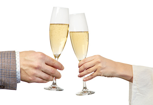 Male and female hands brings glasses of champagne isolated on white. Clipping path included