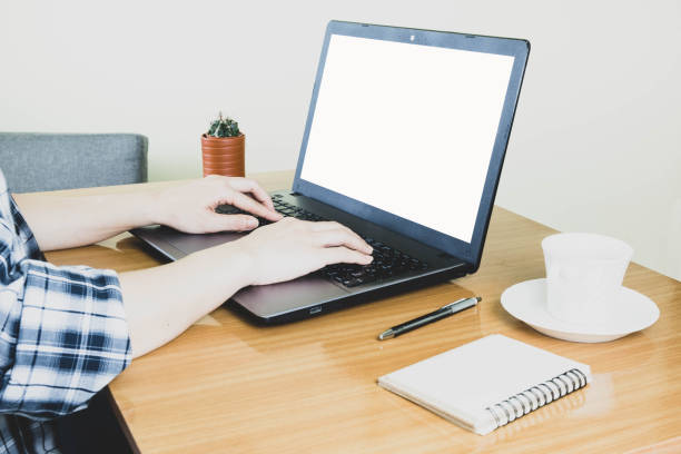 istock Selective focus, hand typing on keyboard,blank screen laptop and coffee on wooden table,work online lifestyle,relax at home with coffee ,home working laptop,work from home concept 1221225521