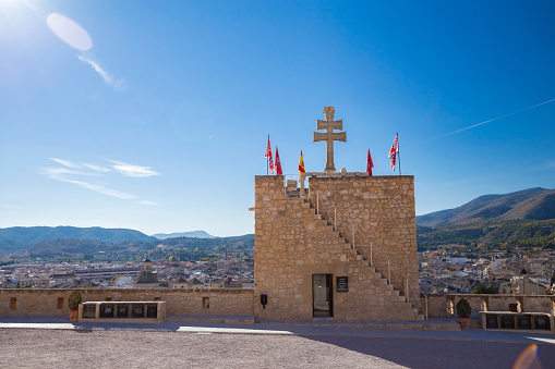 Caravaca, Spain - 17 November 2017 : the Vera Cruz de Caravaca cross on top of a castle tower, Caravaca de la Cruz