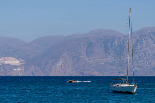 Greek traditional fishing boat in blue sea. Crete island, Greece