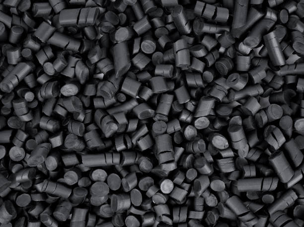 schwarzes gummigranulat - polymer stock-fotos und bilder