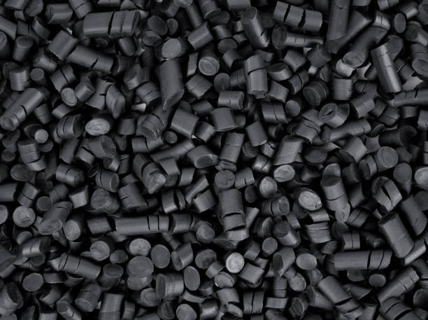 granules en caoutchouc noir - rubber photos et images de collection