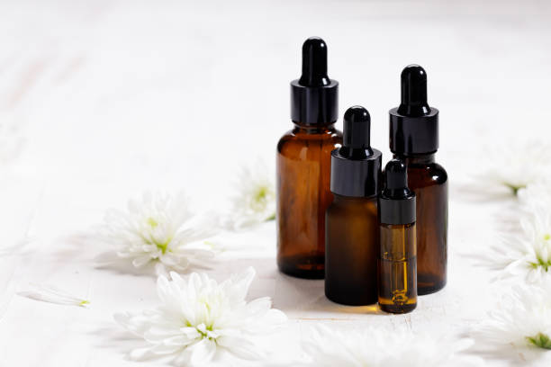istock herbal oil and white flowers 1221231572