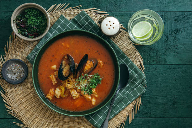 cacciucco – tuscan seafood stew on dark green background. - food high angle view table stew imagens e fotografias de stock