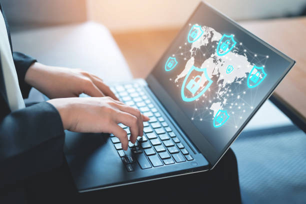 business woman using laptop under protection of encryption of data on internet