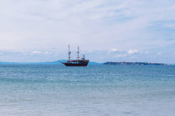 istock A vessel with sails raised floats on the sea 1221233373