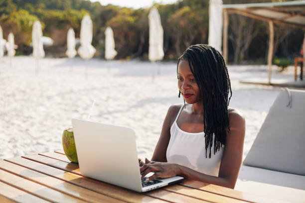 istock Woman working on laptop outdoors 1221235522