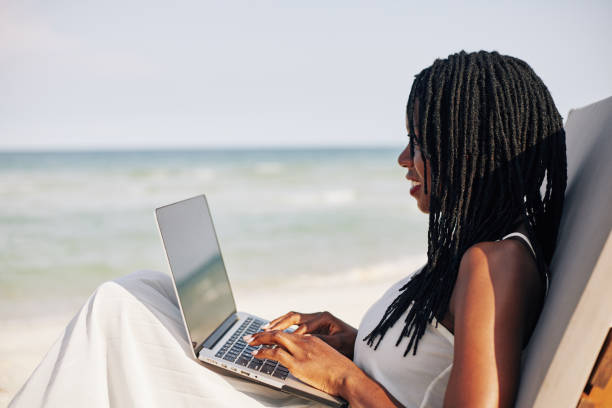 istock Businesswoman on beach 1221235551