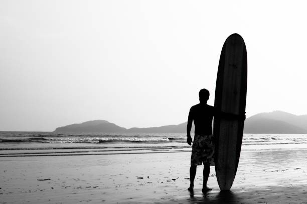 istock Silhouette of a surfer watching the sea 1221236428