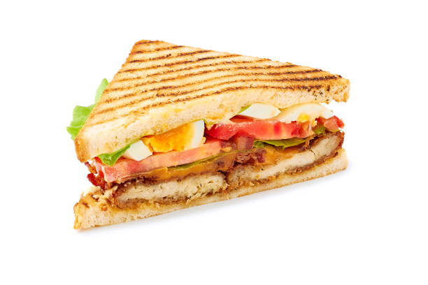 istock Slice of juicy club sandwich on white 1221237677