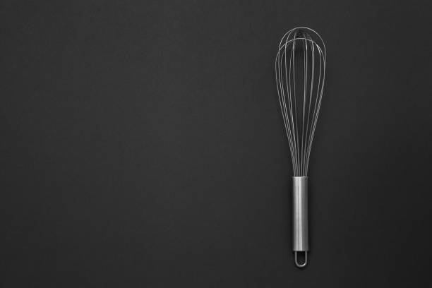 istock Metal whisk for whipping on a black background. 1221237728