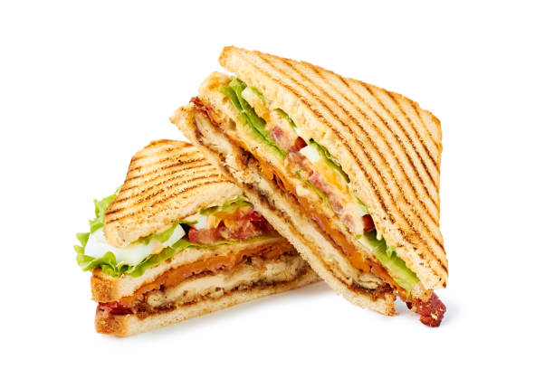 two halves of club sandwich on white - grilled chicken fotos imagens e fotografias de stock