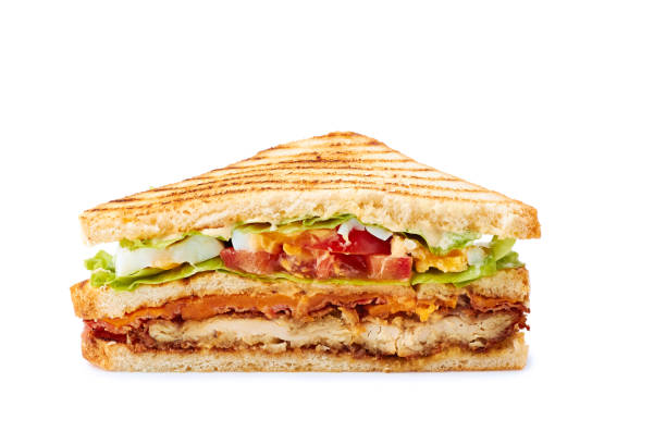 istock Slice of juicy club sandwich on white 1221237778