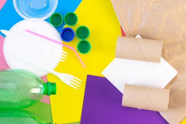istock Garbage, plastic and paper, on a colored abstract background. Ecology and pollution of the planet earth. Sorting garbage. 1221239045