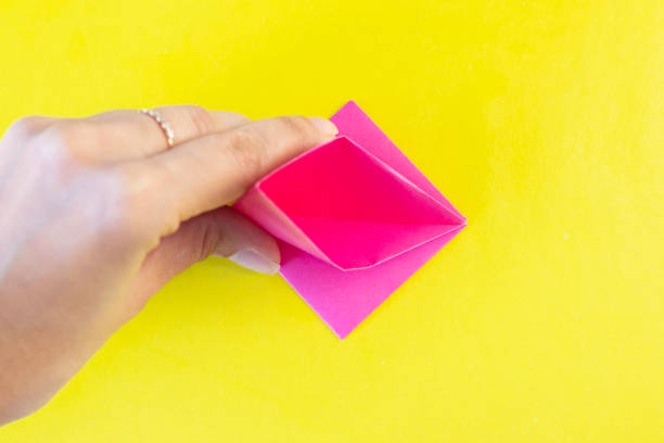 istock Step 10. DYI tulip from colored paper. Step-by-step instruction. DIY gift for Mother's Day, March 8th. 1221239621
