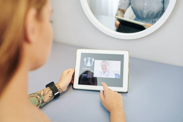 istock Woman video calling her doctor 1221240822