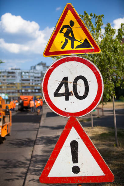 This road sign, a red circle around the number 20, signifies a speed limit, a maximum speed of twenty miles an hour here in the UK.