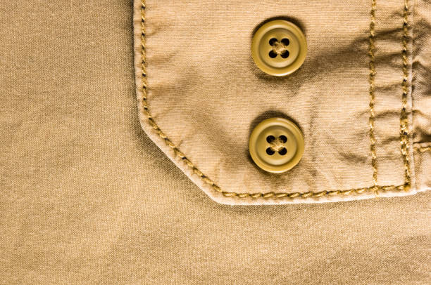 istock clothing items stonewashed cotton fabric texture with seams, clasps, buttons and rivets, macro 1221244848