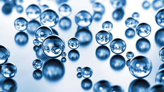 Background image of multiple water droplets (light blue)