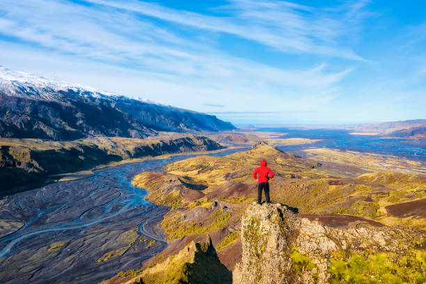 istock Hiker Overlooking Glacier River from Thorsmork in Southern Iceland 1221246313